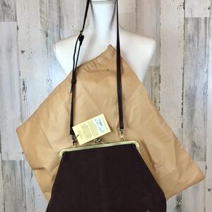 #70
Patricia Nash
Suede Vivienne Frame Kisslock Crossbody Bag .